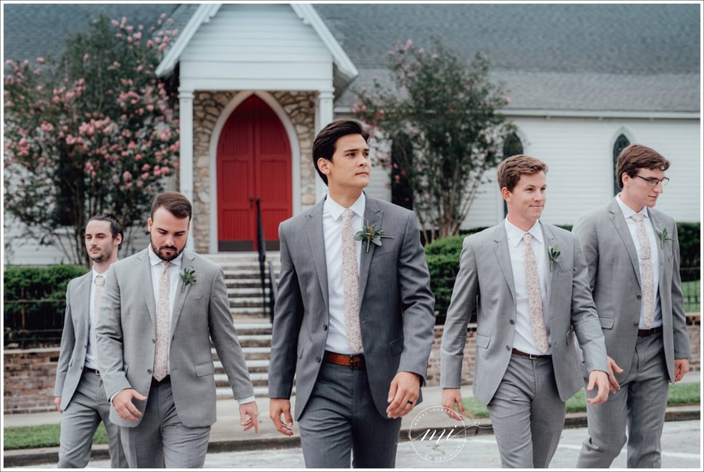 Groom leading his groomsmen to the ceremony in downtown, Ocala, FL